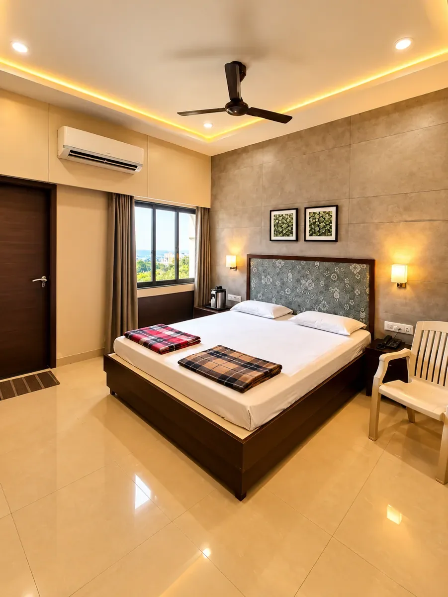 Deluxe AC room with a large window and city view in Bhuj dharamshala